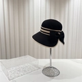 Dettaglio cappello in paglia nero con fiocco beige e trama intrecciata raffinata - Taglia unica / Nero