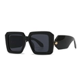 Modern black square chunky sunglasses with a textured gold sphere on the temple arm - Black Frame Black Gray Lens