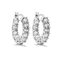 Close-up of small huggie hoop earrings with micro-pave cubic zirconia in silver - Style E Pair / White Gold