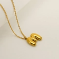 Minimalist golden bubble initial M pendant necklace in polished stainless steel finish - Letter M / Gold