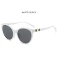 Cat-eye sunglasses with white frame, grey lenses, and gold-black snake scale temple detail - White Frame Dark Grey Lens