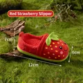 Plush strawberry-shaped baby slippers in bright red with green leaf and cartoon smile - Red Strawberry Shoe