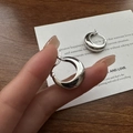 Polished S925 sterling silver U-shaped crescent hoop earrings shown for scale - White Gold