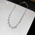 Detail of silver chain necklace with square-cut zircons on beige velvet display tray - Necklace-Silver-White