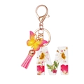 Resin letter M keychain with real flowers, butterfly charm and pink tassel ornament - Flower Pattern M