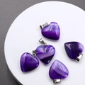 Set of five polished purple agate heart pendants with silver clasps on display stand - Purple Agate