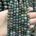 Bunte runde Natursteinperlen für DIY-Schmuck in verschiedenen Farben in der Hand - Indischer Achat A317 / 4mm (ca. 88 Perlen)
