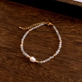 Detail of beaded bracelet with grey moonstone, freshwater pearl, and golden clasp - Bracelet / White