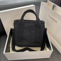 Chic black canvas tote bag in white gift box with adjustable strap and top handles - Black