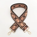 Close-up of geometric ethnic wide guitar strap with pink patterns and gold metal buckles - Black Khaki Pink