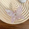 Iridescent butterfly hair claw in light purple acetate with marble texture on wood tray - 6.5cm / Floral Purple