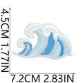 Detail view of blue ocean wave embroidered patch with dimensions 7.2cm by 4.5cm - Gradient Ocean Wave