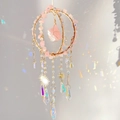 Detail of rose quartz suncatcher showing crystal prisms and rainbow light refraction - Rose Quartz
