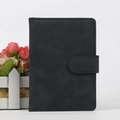 Matte black RFID blocking passport cover with snap button closure and embossed logo - Black