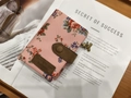 Women's pink floral bi-fold wallet in canvas with a brown leather strap and bear charm - Handheld Pink Rose Pattern
