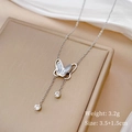 Detail of silver butterfly pendant with white shell wings and tassels, weight 3.2g - Silver