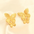 Golden butterfly earrings in double-wing design on soft beige silk background - Gold Double Butterfly Stud Earrings