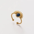 Close-up of golden twisted ring with blue oval stone and sunburst eye design - Sunbeam Blue (ZJ228)