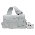 Minimalist light blue denim crossbody bag with top knot handle and plush charm detail - White