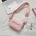 Pink nylon crossbody bag featuring cute bow embroidery and adjustable wide strap - Light Pink