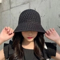 Detail of black woven straw hat showing intricate hollow-out texture and summer sun protection - Single Layer Black