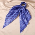 Close-up of blue silk satin scrunchie with evil eye pattern and long flowing ribbons - 8# Dark Blue Palm