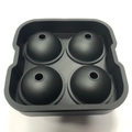 Black silicone four-grid spherical ice mold for making round ice balls on white background - 4-Sphere Ice Tray Black
