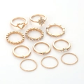 Set of 11 gold rings featuring moon designs and sparkling rhinestones on white background - Heart Star Diamond Gold Stackable Ring Set (10418)