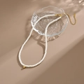 Baroque pearl necklace with gold sphere pendant and adjustable lobster clasp - H381 Elegant All-over Pearl String Necklace Gold Detail