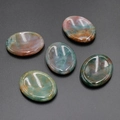 Polished agate thumb worry stones in green and reddish brown for facial gua sha massage - India Agate