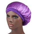 Detailed view of large purple satin bonnet showing wide elastic band and smooth silk texture - One Size / Purple