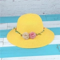 Detailed view of yellow woven straw hat featuring soft pink and beige fabric floral trim - M (56-58cm) / Yellow