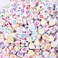 Macro shot of white acrylic heart beads with colorful alphabet letters for DIY jewelry - Heart Shape White Colored Letters (100pcs)