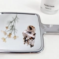 Mini acetate hair claw clip with classic tortoiseshell pattern on a silver mirror - Gray Tortoise