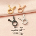 Taurus zodiac charms in gold, rose gold, silver and black finishes on pink silk - Taurus