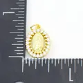 Oval gold Virgin Mary pendant charm with sparkling cubic zirconia border and ruler scale - Guadalupe Virgin Mary