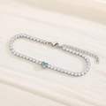 Silver tennis bracelet featuring white cubic zirconia and a heart-shaped blue gemstone - Silver Blue Stone (KB168991-Z)