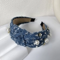 Denim blue knotted headband with faux pearls and rhinestones on a white background - Dark Blue Pearl Headband
