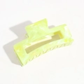 Detailed view of lemon yellow hair claw clip with marble texture and cut-out design - Yellow Smudge Marble