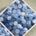Macro shot of 10mm blue gradient ice-cracked glass beads in a white plastic box - 10mm / Blue White