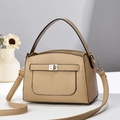 Beige litchi-grain PU leather handbag with gold buckle and adjustable strap on a minimal background - Khaki