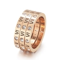 Three-in-one rose gold ring featuring Roman numerals and sparkling cubic zirconia - US 7