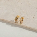 Minimalist gold flip-flop stud earrings with colorful zircon stones on stone surface - Slipper Shape (ES2544-4)