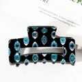 Große schwarze Haarklammer mit Evil-Eye-Muster und glänzender Oberfläche in Rechteckform - Schwarz/Evil Eye Druck