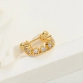 U-shaped minimalist golden nose stud with faceted clear zircons on a white background - Tooth Style