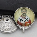 Macro shot of silver metal Orthodox reliquary with embossed patterns and St. Nicholas icon - Silver-14 (St. Nicholas Portrait)
