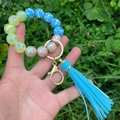 Glow-in-the-dark silicone beaded keychain bracelet with blue tassels and floral prints - Blue Leopard