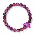 Purple spotted stone bead bracelet with a carved dolphin charm on a white background - Purple