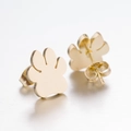 Detail view of gold bear paw earrings featuring smooth metallic finish and butterfly backs - 104 Paw - Gold