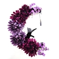 Macro detail of crescent moon wreath with purple flowers, black cat silhouette and crystal - Halloween Moon Cat Wreath